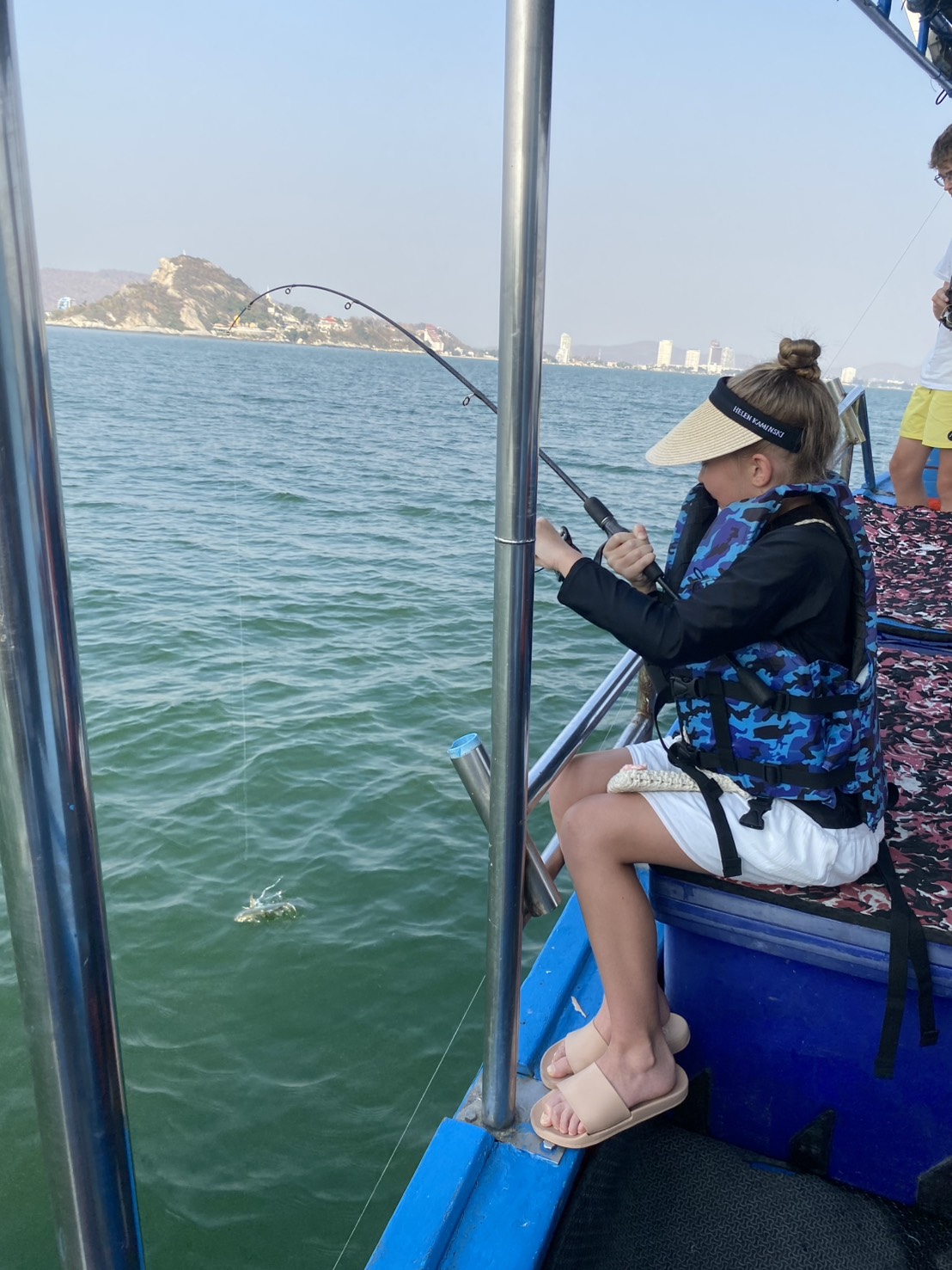 Gear and bait are ready. Captain Yod helps beginners.
